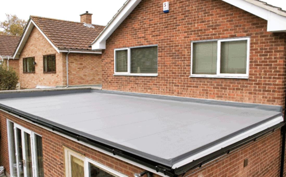 GRP flat roof over a rear extension with a dormer window above